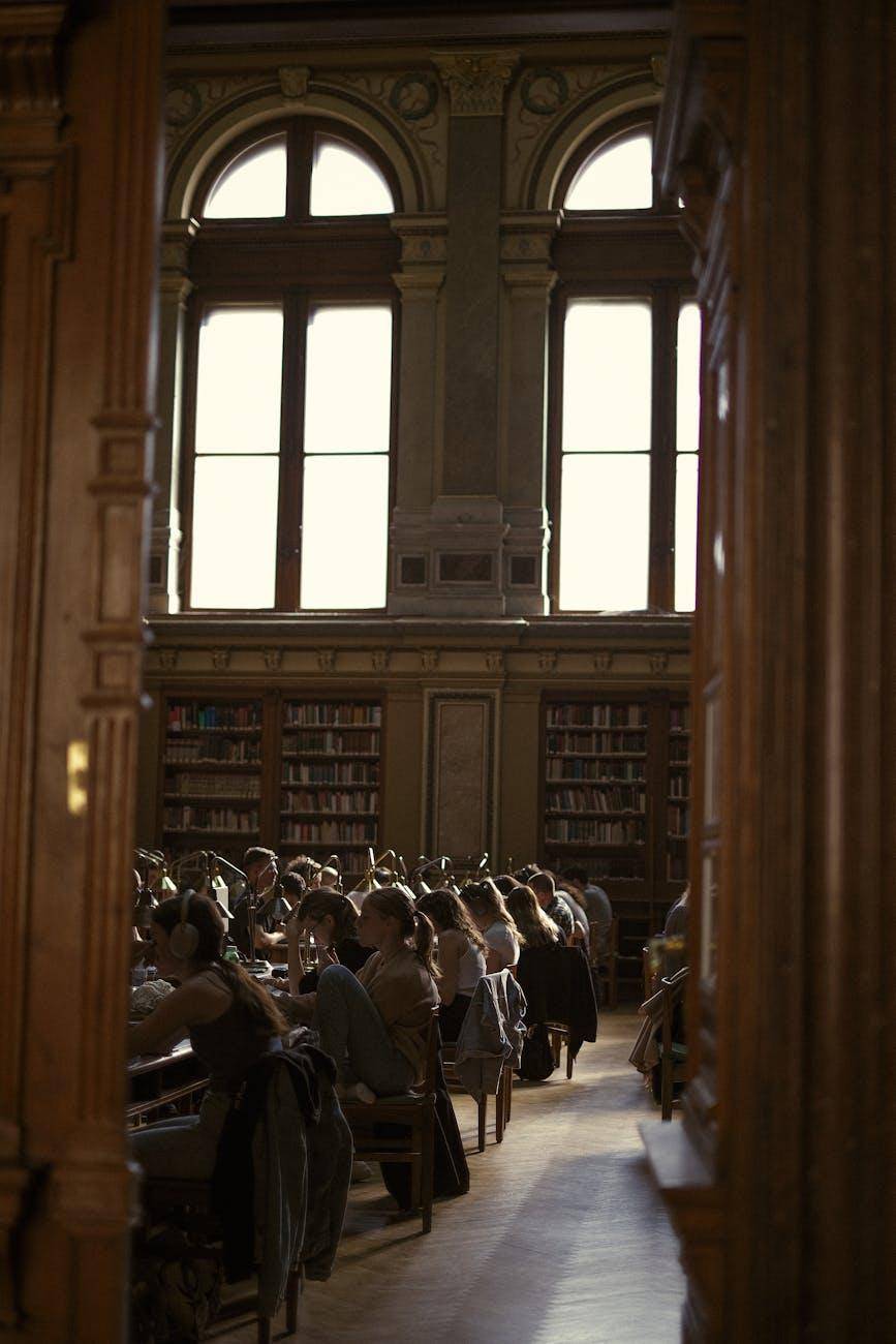 Alumni reading in the library